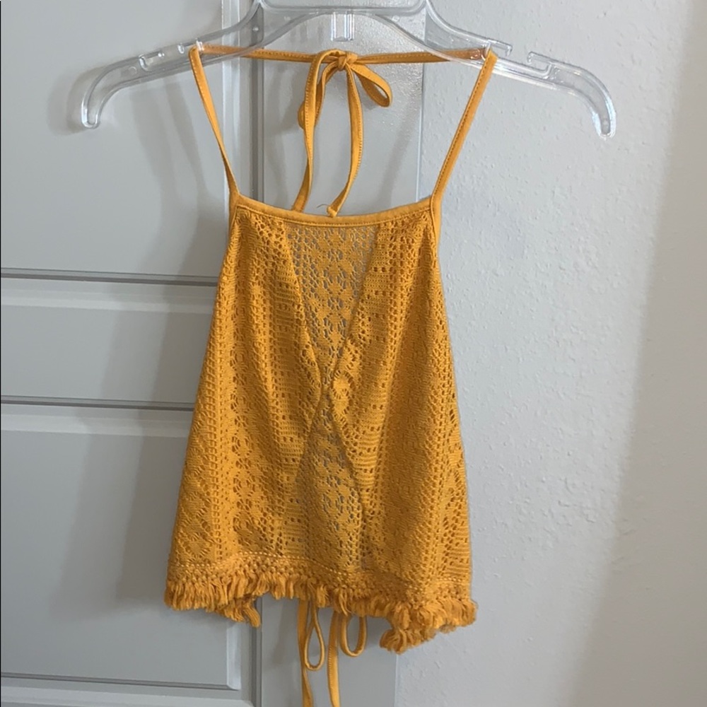 mustard yellow tie crop top.